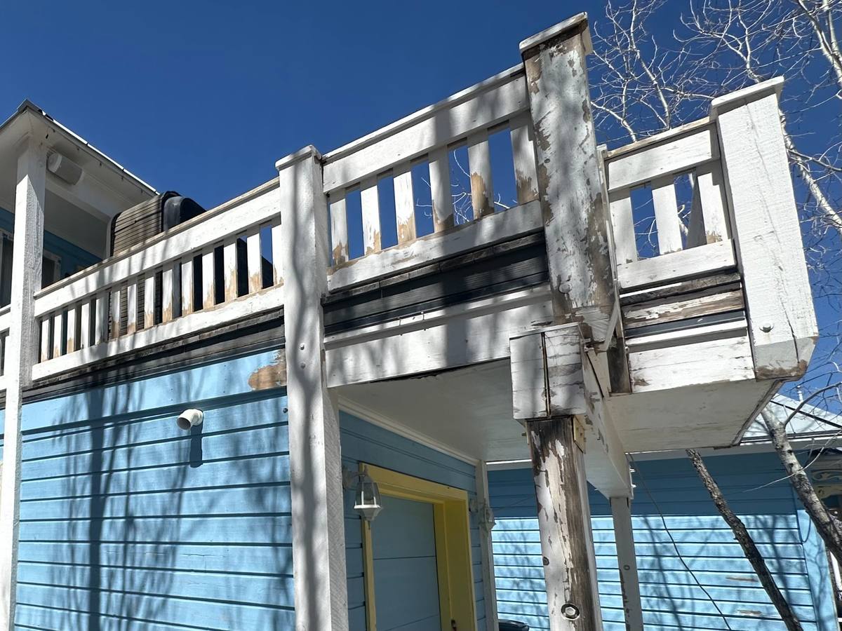 Exterior paint failure Park City Utah climate damage deck railing peeling prevention