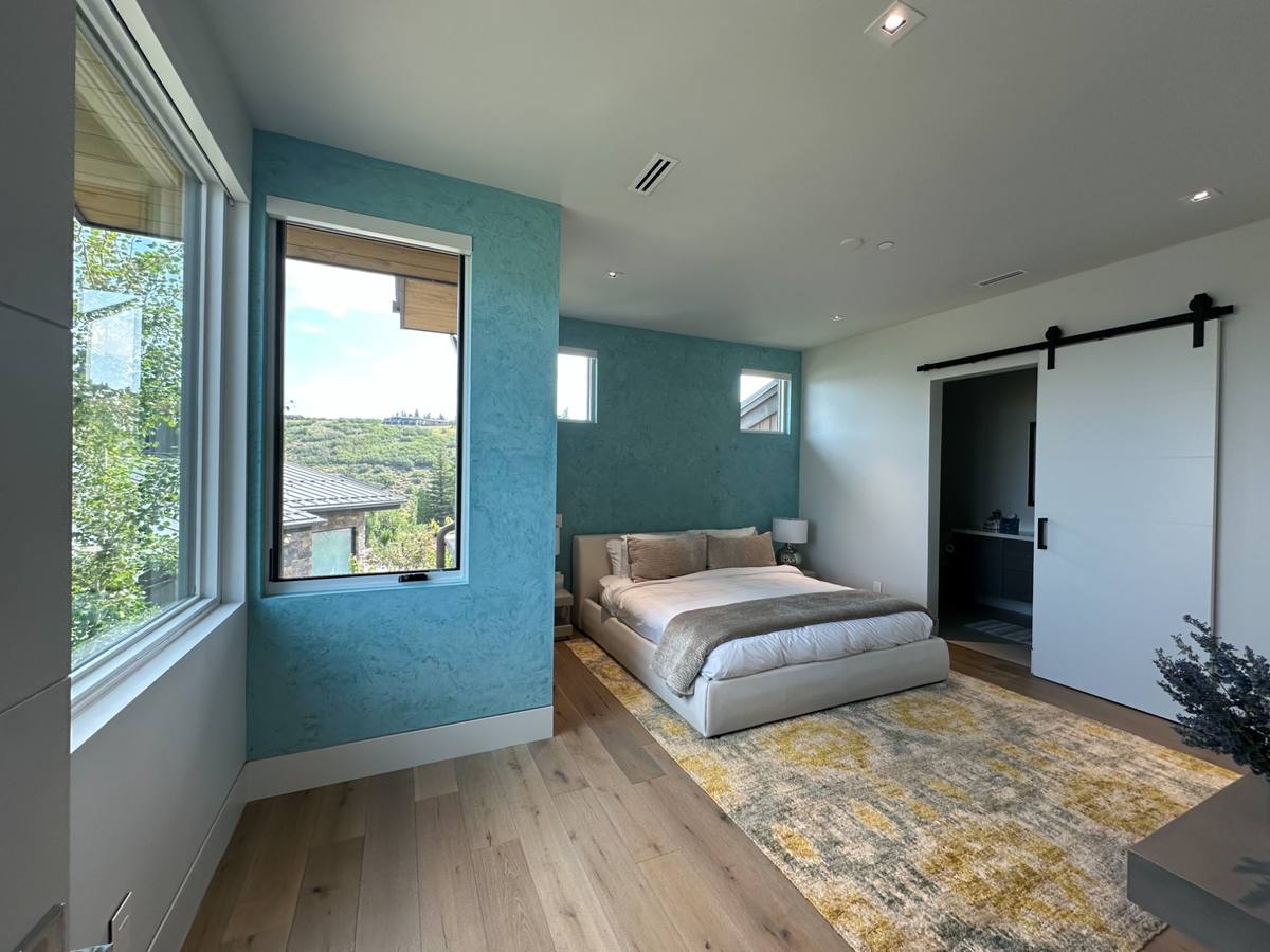 Choosing interior paint colors Park City Utah bedroom teal accent wall designer tips
